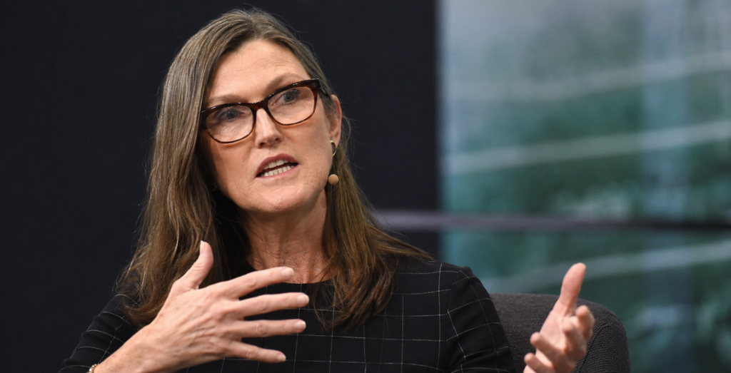 Cathie Wood speaks during an interview while gesturing with her hands